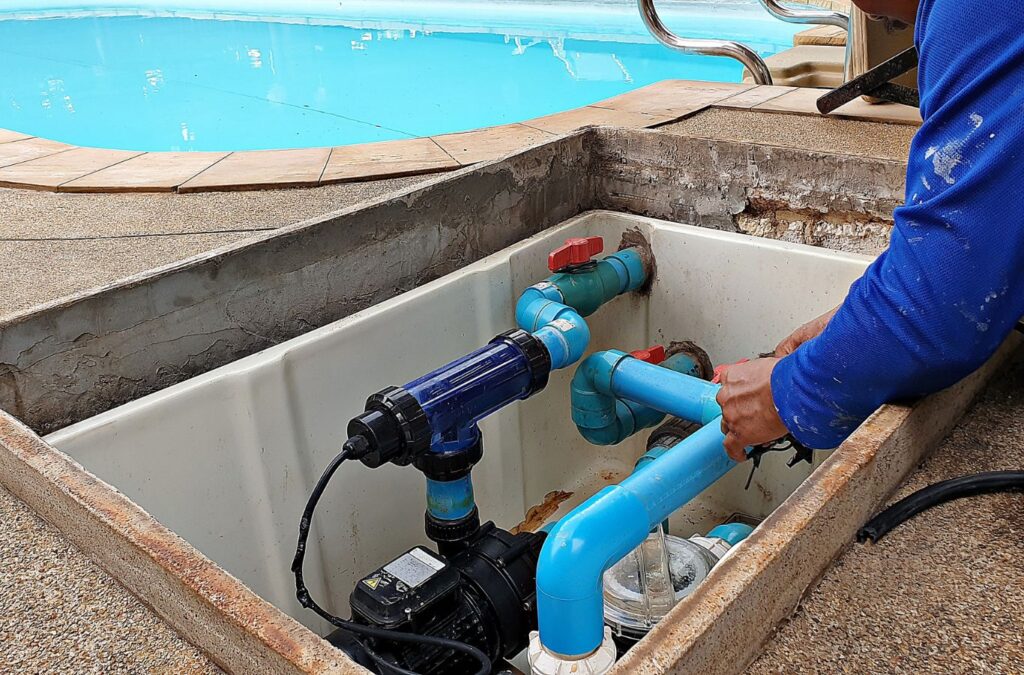 Pool maintenance expert from Alotta Pool Service ensuring the filter system works correctly in Lee County, FL.