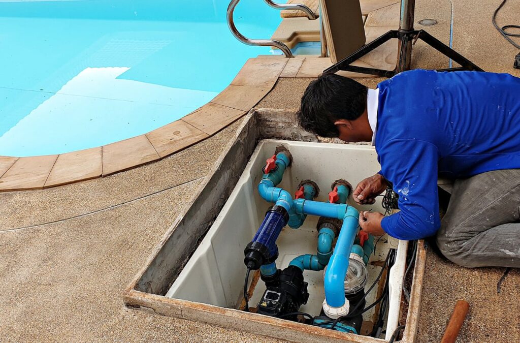 Pool technician from Alotta Pool Service maintaining a pool in Lee County, FL. Pool maintenance near me.