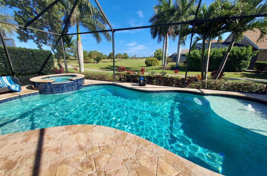 An Alotta Pool Service team member conducting pool care in Estero, FL, emphasizing the value of experienced, local professionals for ongoing pool upkeep.
