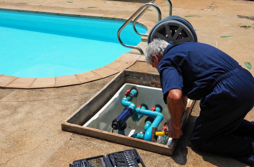 An Alotta Pool Service expert working on a residential pool in Three Oaks, FL, showcasing our precision and commitment to delivering quality service every time. Pool Service near me.