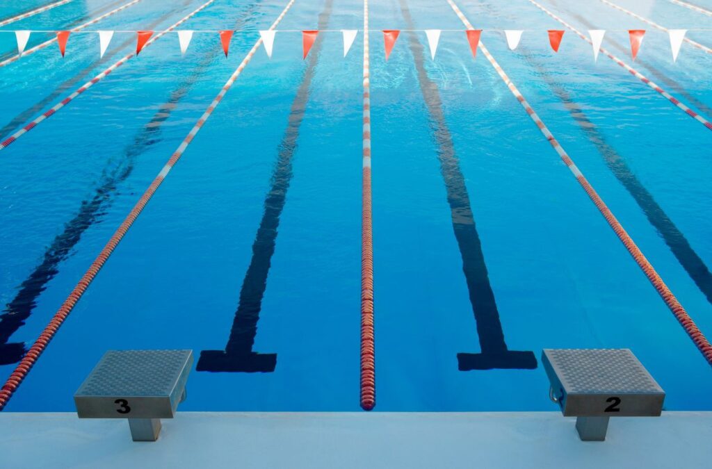 Alotta Pool Service employee carrying out pool cleaning in Three Oaks, FL, highlighting the health, safety, and convenience of professional local service.